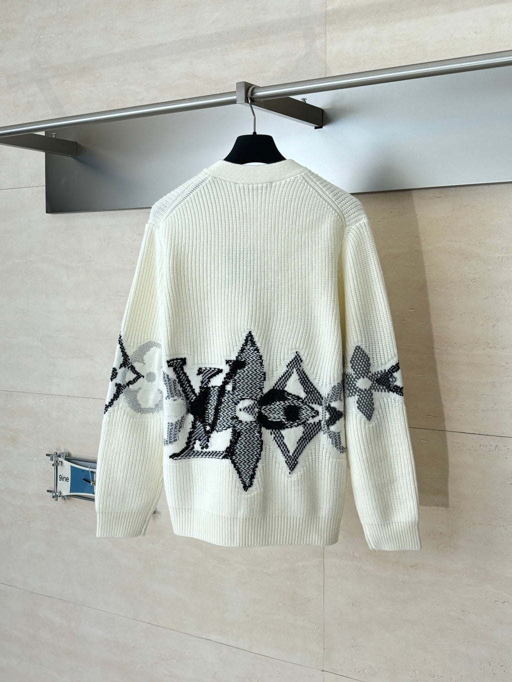 Ivory knit cardigan with large black graphic motif on back