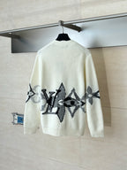 Ivory knit cardigan with large black graphic motif on back