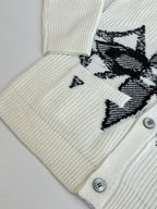 Ivory knit cardigan with black graphic motif and two front buttons