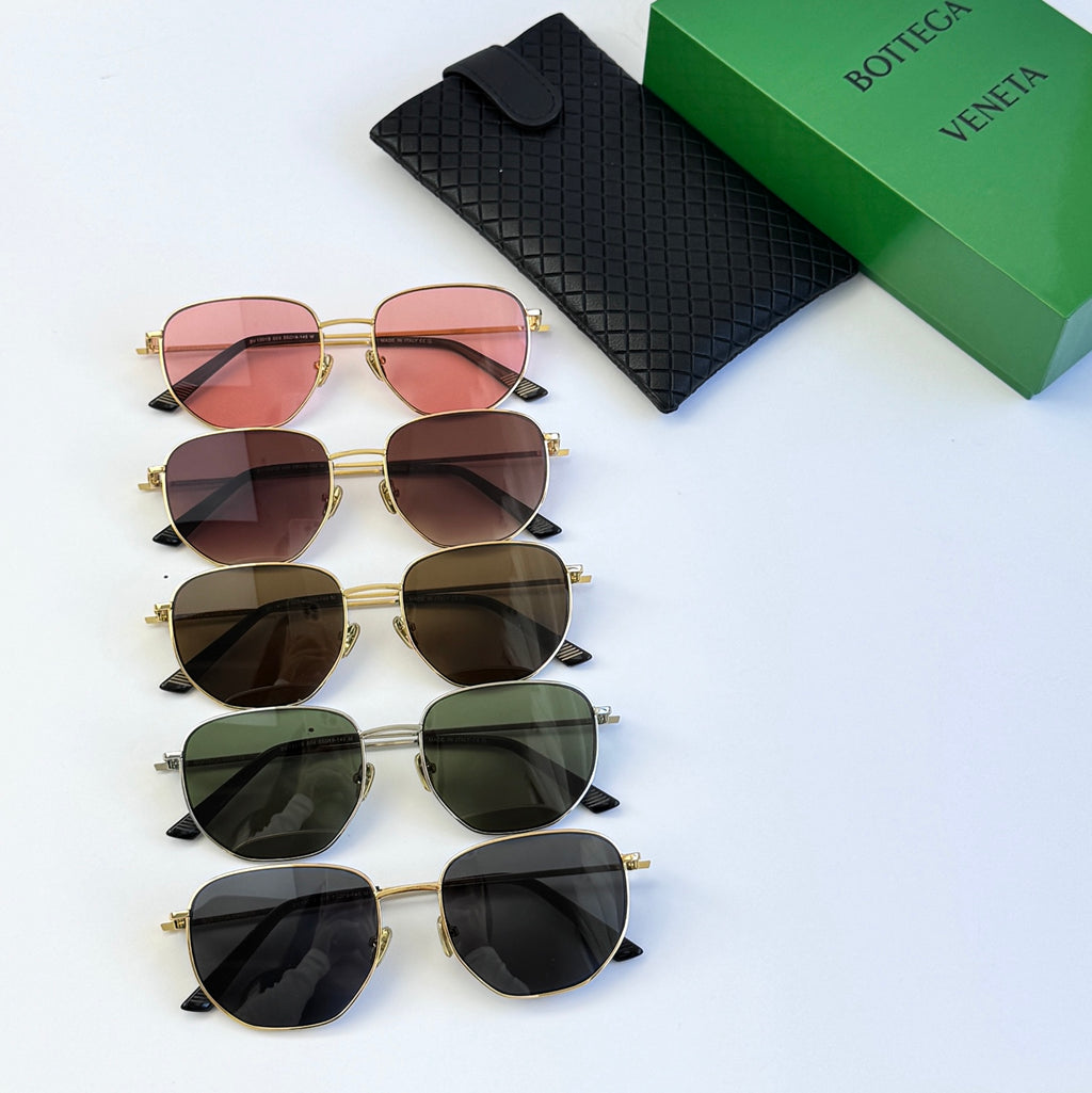 Set of gold-framed sunglasses with mixed colored lenses