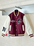 Varsity jacket with maroon body, white sleeves, striped cuffs, and button front.