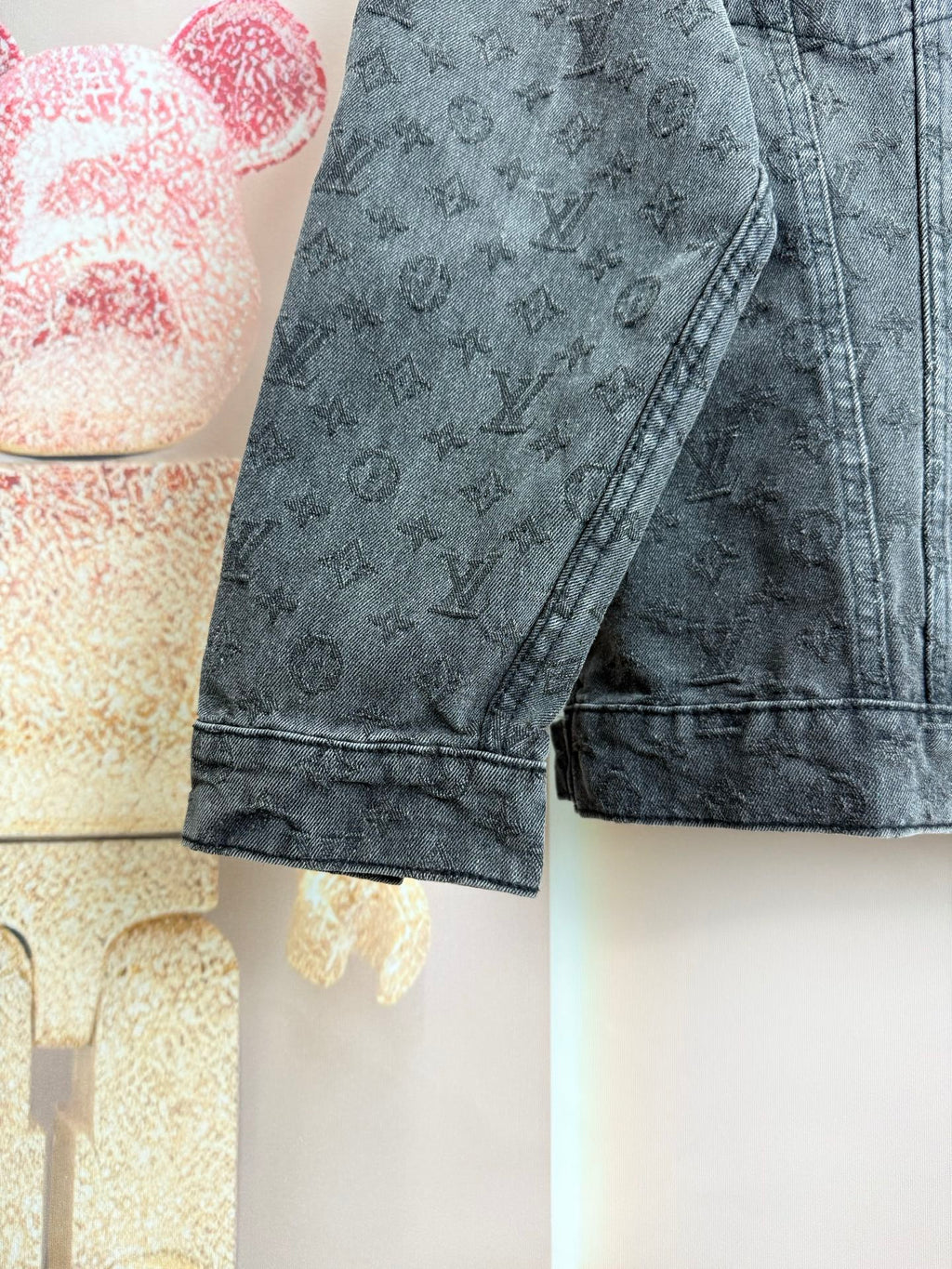 Louis Vuitton dark denim jacket sleeve with monogram pattern