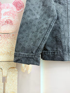 Louis Vuitton dark denim jacket sleeve with monogram pattern