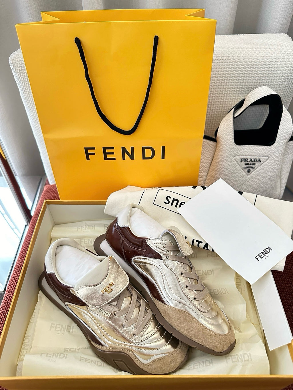 Fendi unisex sneakers, cream and brown two-tone design with lace-up closure