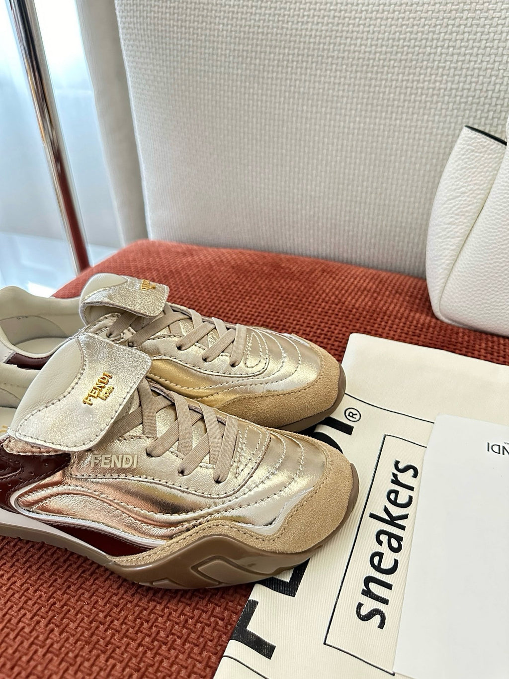 Fendi unisex sneakers, metallic beige upper with lace-up front and logo strap