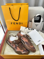 Brown and pink patterned lace-up sneakers with FENDI logos and white rubber sole.