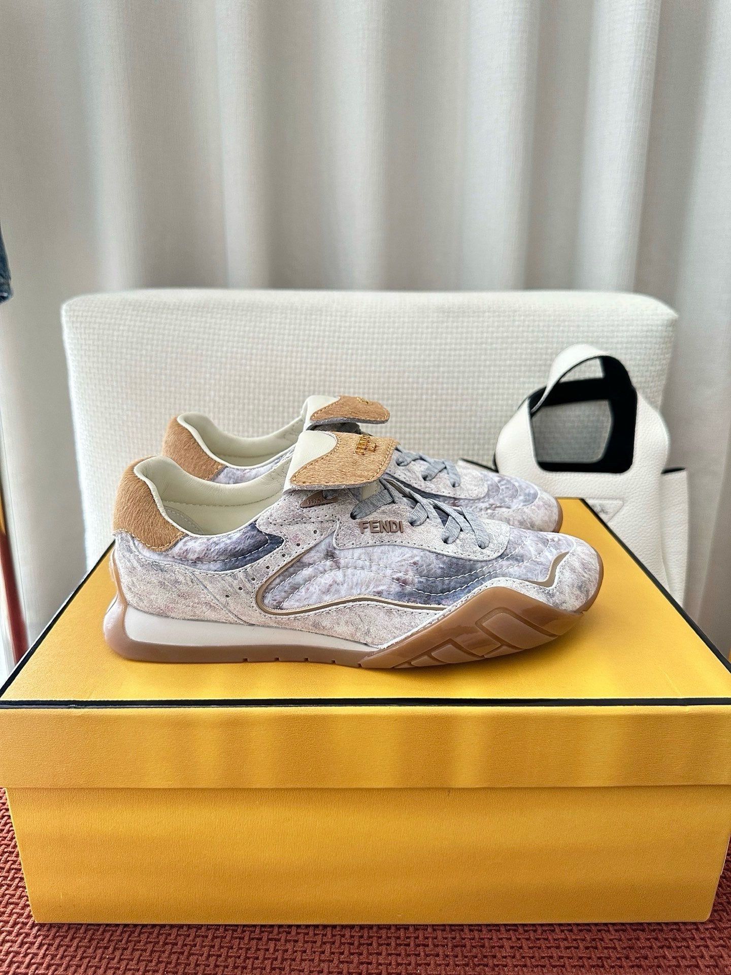 Fendi unisex sneakers in light blue-gray with tan suede heel accents and cushioned collars