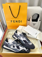 Unisex sneakers with navy-and-white pattern, lace-up front, Fendi logo on tongue.