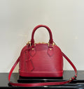 Louis Vuitton red Epi-style handbag with top handles and shoulder strap