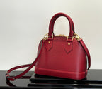 Louis Vuitton red Epi-style handbag with gold-tone hardware and top handles