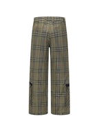 Olive plaid wide-leg pants with black trim panel at the hem