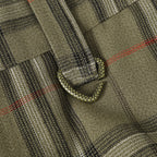 Plaid pants with front pocket seam and small black-trim pull tab