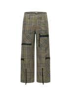 Plaid pants in olive with black contrast panels and utility-style pocket details