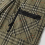 Plaid pants with black zip fly and buttoned waistband