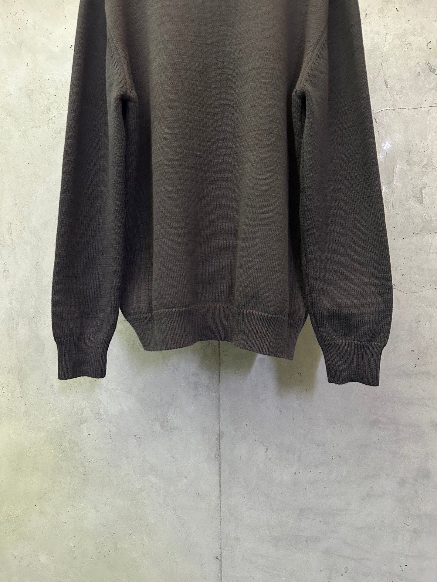 Long-sleeve knit sweater hem and cuffs detail, dark gray