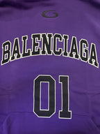 Purple Balenciaga hoodie close-up of 'BALENCIAGA' text and '01' number