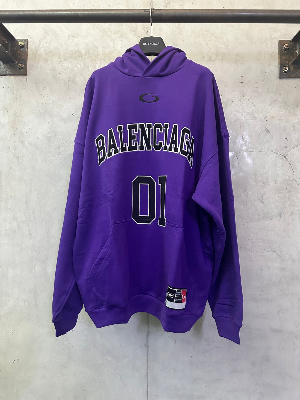 Purple Balenciaga hoodie with front 'BALENCIAGA' text and large '01' graphic