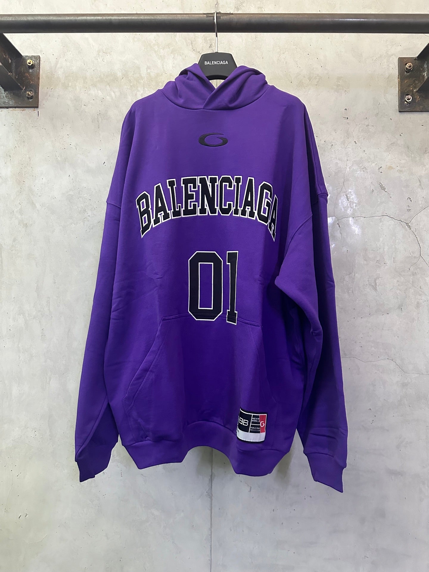 Purple Balenciaga hoodie with front 'BALENCIAGA' text and large '01' graphic