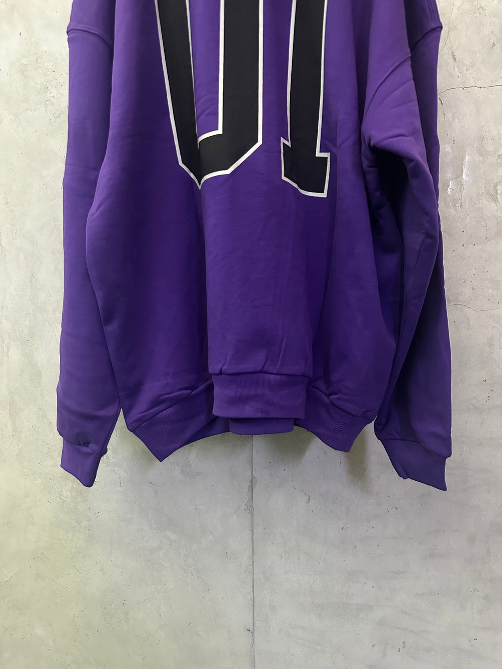 Purple Balenciaga hoodie back view with oversized outlined '01' graphic