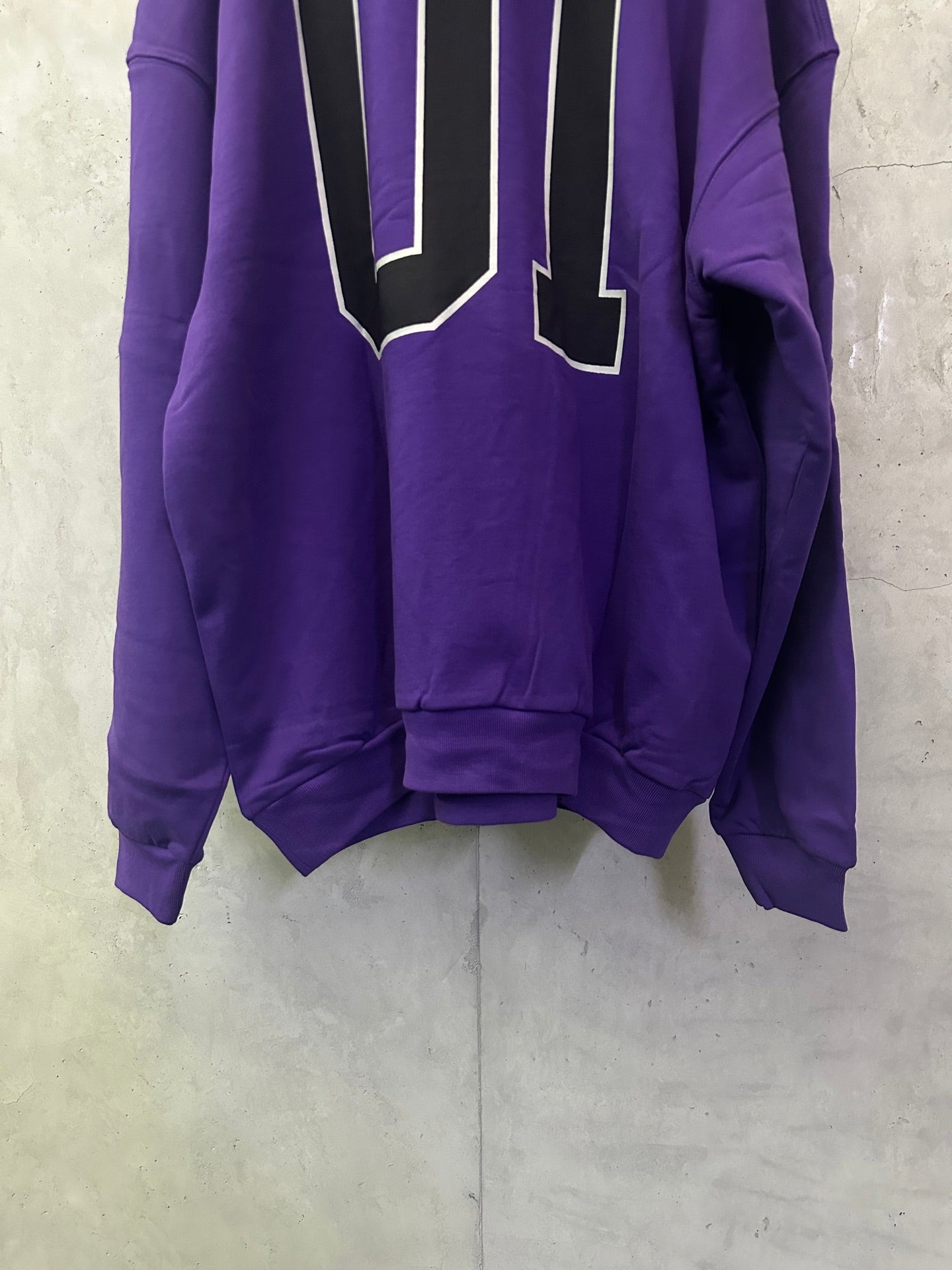 Purple Balenciaga hoodie back view with oversized outlined '01' graphic
