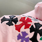 Pink hoodie shoulder and back with embroidered multicolor clover/star applique