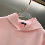 Pink hoodie hood and neckline with small interior brand label