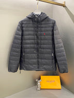 Dark gray quilted hooded jacket with full zip and drawstring hem