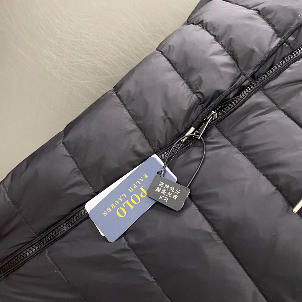 Ralph Lauren puffer jacket with full zipper and attached hang tag, dark charcoal