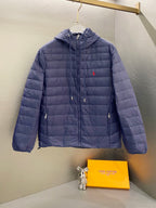 Navy quilted hooded jacket with full zip, drawstring hem and small chest logo
