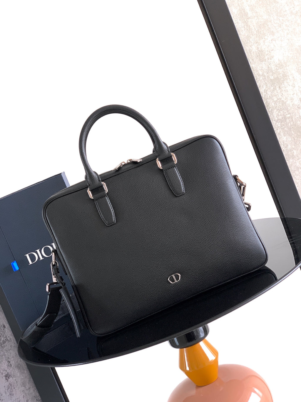 Men's Dior leather handbag with top handle and gold-tone hardware