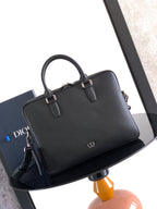 Men's Dior leather handbag with top handle and gold-tone hardware