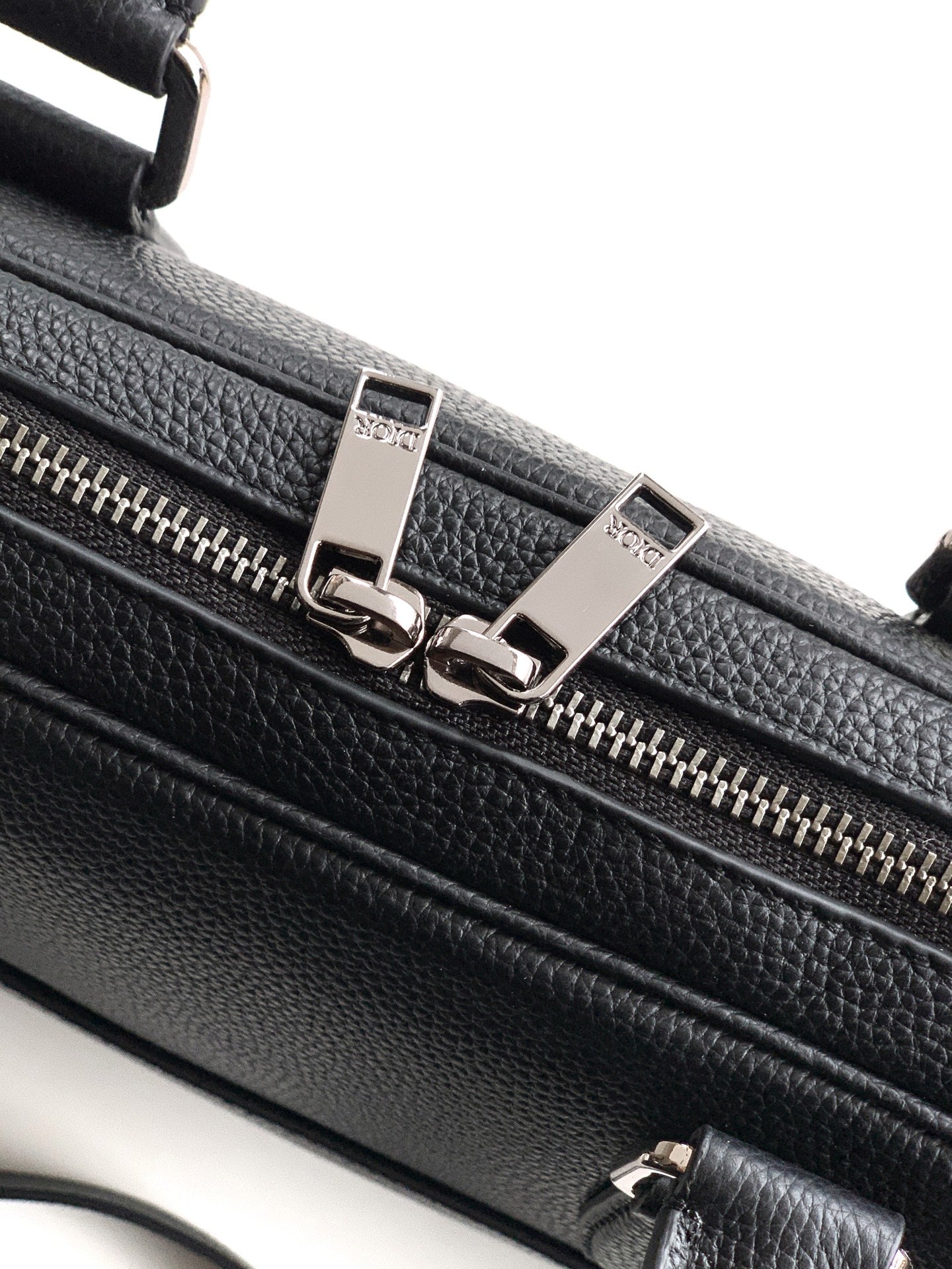 Dior men's leather bag with dual zippers and metal clasp hardware