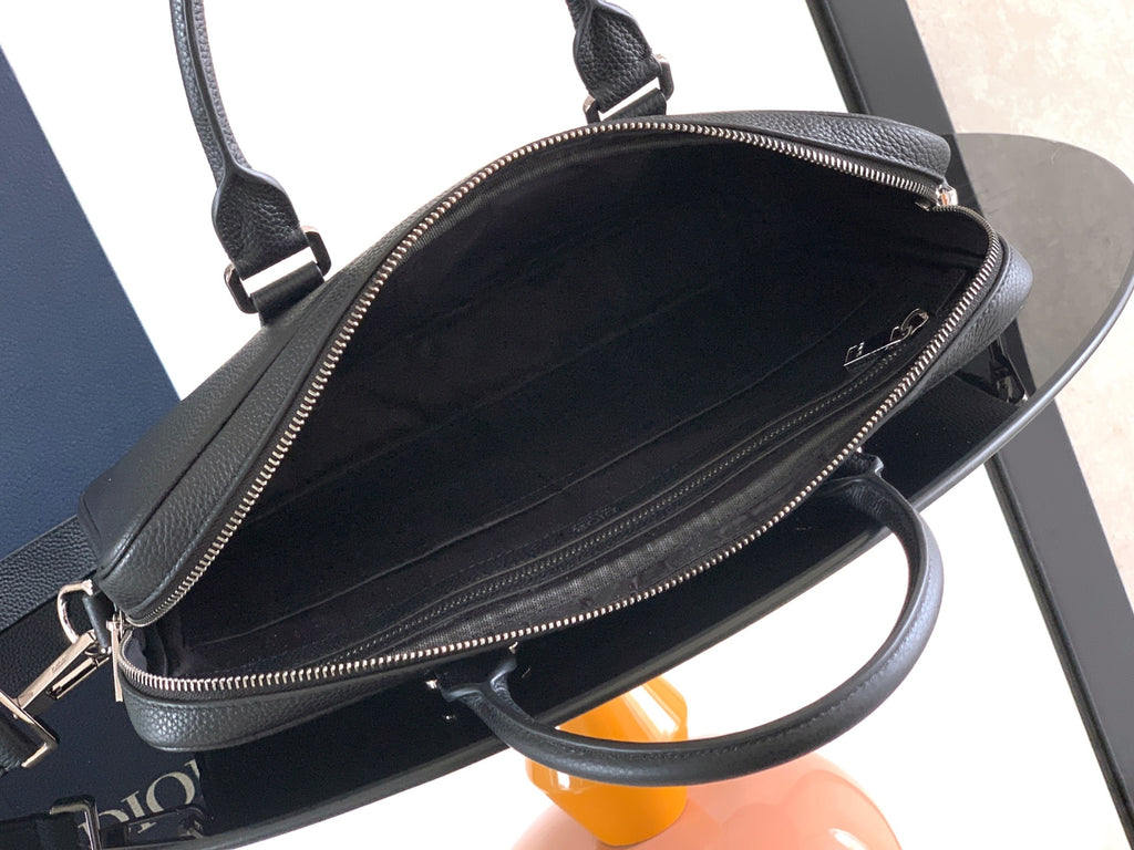 Men's Dior leather crossbody bag with round zip-top and adjustable strap