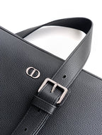 Black leather strap detail with engraved logo and buckle hardware
