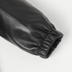 Black leather jacket cuff with gathered elastic at the sleeve end