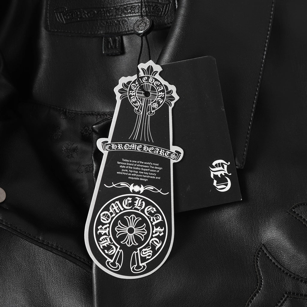 Black leather jacket with white hang tag attached near collar