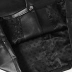 Black long pants with front seams, button tab, and embossed pattern panels