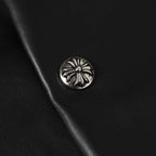 Black leather jacket with round silver-tone snap button