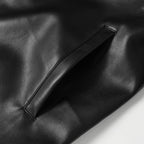 Black leather jacket front pocket seam and leather panel detail