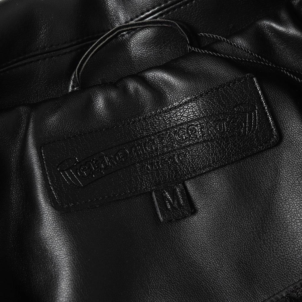 Black leather jacket neckline with inner label and snap detail