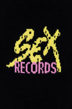 Black sweatshirt with yellow “Chrome” letters and “RECORDS” in pink on front