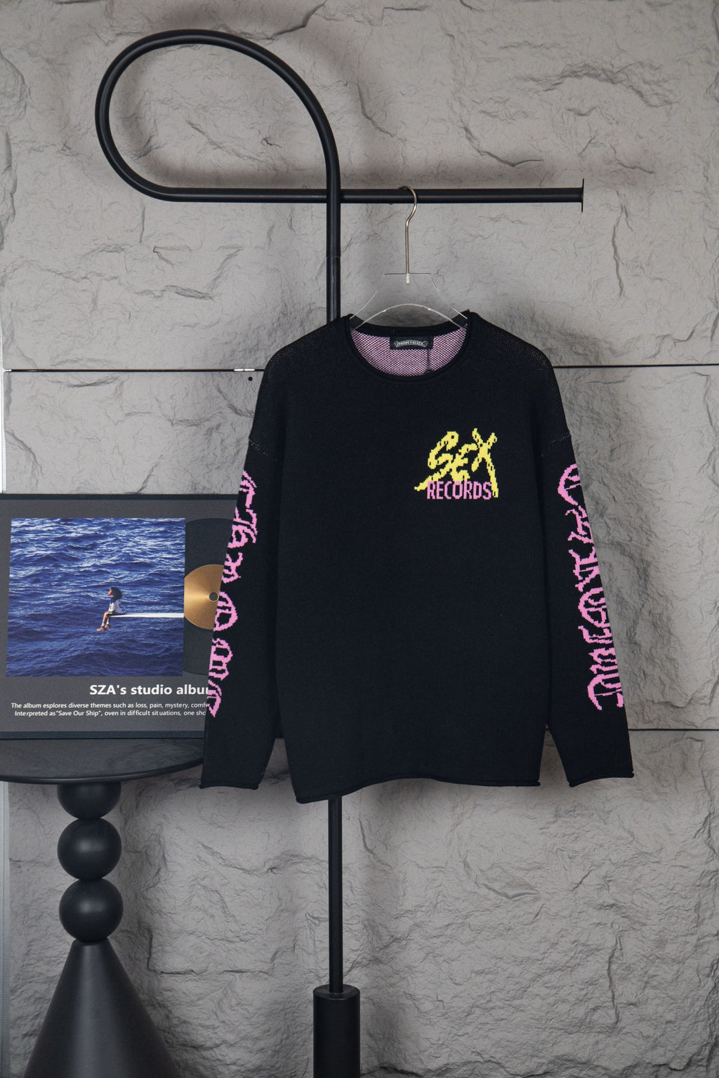 Black long-sleeve sweatshirt with yellow “Chrome Records” graphic and pink sleeve text