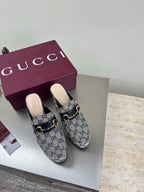 Gucci platform mules in blue GG canvas with gold horsebit detail and black trim