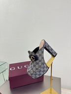 Gucci platform mule on tall gold heel stand, blue GG canvas and gold trim