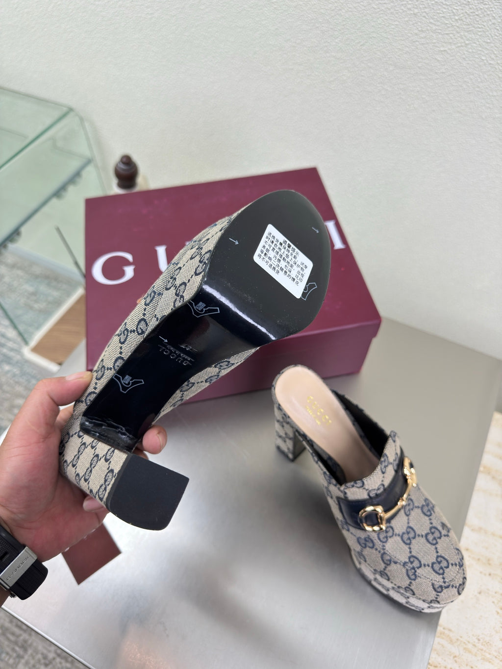 Gucci mule sole view and uppers in blue GG canvas with gold horsebit detail