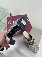 Gucci mule sole view and uppers in blue GG canvas with gold horsebit detail
