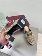 Gucci GG canvas mule loafer with gold-tone horsebit, sole and heel detail