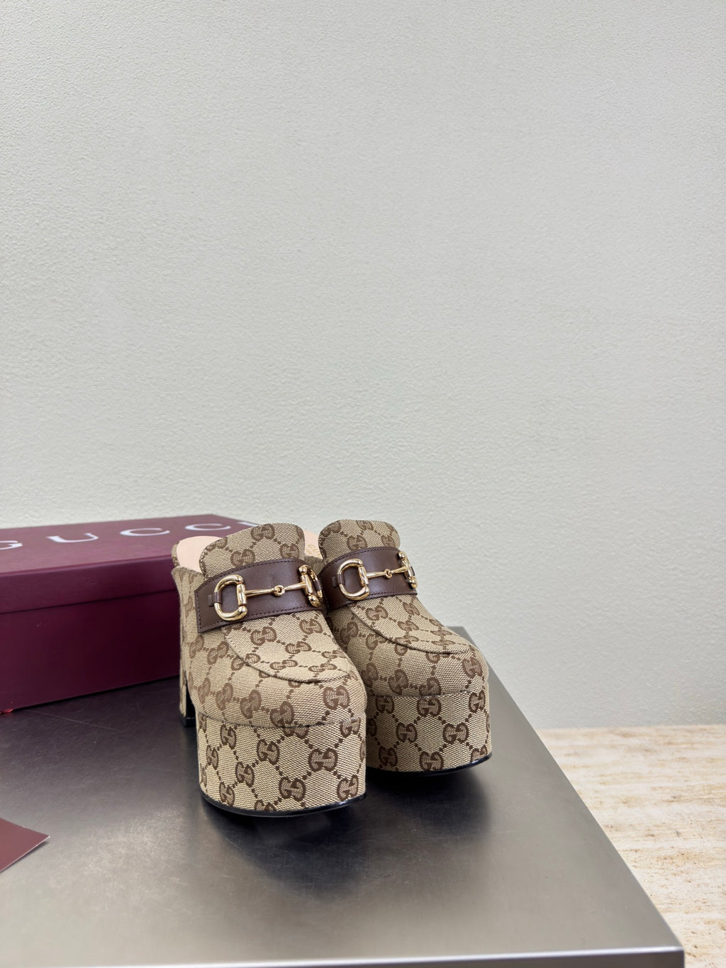 Gucci GG canvas mule loafers with gold-tone horsebit strap, side view