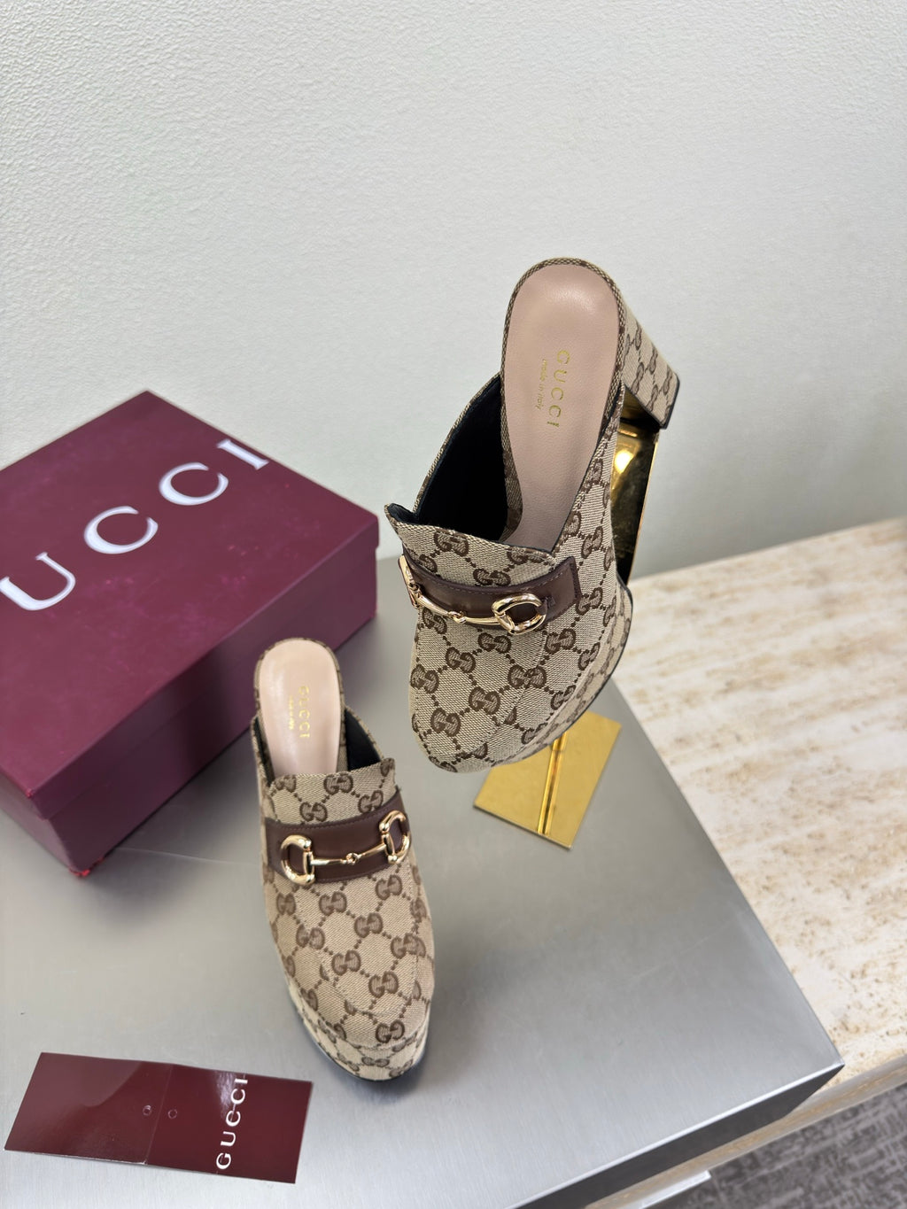 Gucci GG canvas mule loafers with gold-tone horsebit, heel and toe shown