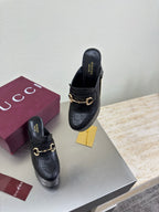 Black Gucci mules with gold horsebit detail and block heel, side-by-side